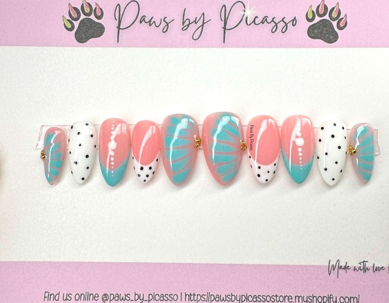 Nail art designs with pink and turquoise patterns on a white background, branded 'Paws by Picasso'.